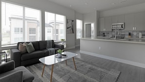 A modern apartment with a living room, kitchen, and large windows. - Landing | Modern 2BD, Gym, Pool (Round Rock)