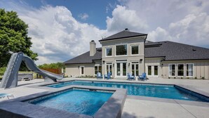 A two-story house with a swimming pool, a slide, and outdoor seating. - Majestic Manor-private Hundred Acre Yard-pool/spa (Lebanon)