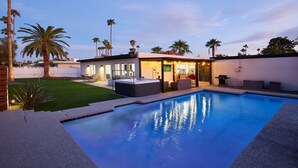 A modern outdoor pool area with a hot tub, a patio with seating, and a well-maintained lawn. - Desert Rose-hot Tub-pool Heat Avail-fire Pit-golf! (Scottsdale)