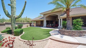 A house with a patio, a lawn, and a large cactus. - Valley View Villa - Private Pool - Hidden Bedroom (Scottsdale)