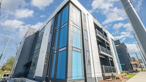 A modern building with large windows and a balcony. - Gallatin Retreat-private Balcony-in East Nashville (Nashville)