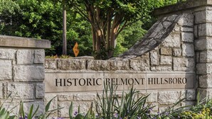 A stone sign with "HISTORIC BELMONT HILLSBORO" engraved on it.