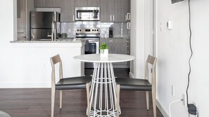 Fridge, dining tables - Landing | Beautiful 1BD, Gym, Pool (Pflugerville)