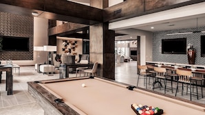 A modern lounge area with a pool table, seating, and a bar. - Landing | Amazing 2BD, Clubhouse, Pool (San Antonio)