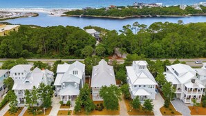 A coastal residential area with multiple white houses, a marina, and a view of the ocean. - 🦩Book Me Baby! Grayt Escape Private Home at The Preserve🦩 (Santa Rosa Beach)