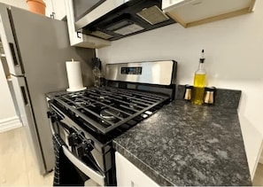 Luxury Apartment, Multiple Beds, Non Smoking, Air conditioning | Private kitchen | Full-sized fridge, microwave, oven, stovetop