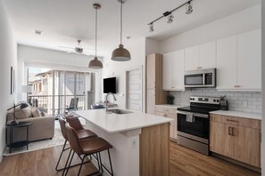 Fridge, dining tables - Landing | Modern 1BD, Gym, Pool (Austin)