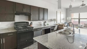 Fridge, dining tables - Landing | Spectacular 1BD, Yoga Studio, Gym (Fort Worth)