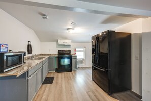 Fridge, stovetop, dishwasher, coffee/tea maker
