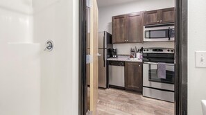 Fridge, dining tables - Landing | Stunning Studio, Courtyard, Gym (Portland)
