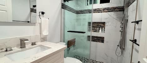 Shower, hair dryer, towels, soap