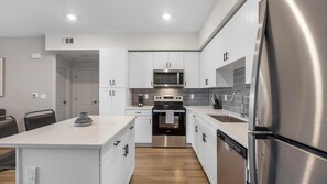 Fridge, dining tables - Landing | Modern 1BD, Rooftop Lounge, Pool (Henderson)