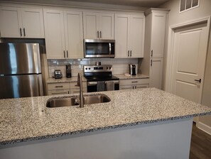 Fridge, dining tables - Landing | Incredible 2BD, Pool, Gym (Newberry)