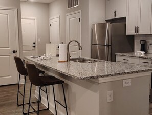 Fridge, dining tables - Landing | Spectacular 2BD, Pool, Gym (Newberry)