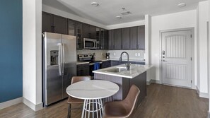 Fridge, dining tables - Landing | Modern 1BD, Gym, Courtyard (Denton)