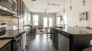 Fridge, dining tables - Landing | Amazing 1BD, Pool, Game Room (New Braunfels)