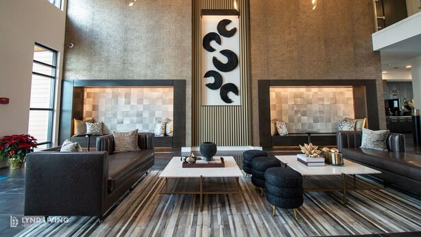 A modern living room with sofas, a coffee table, and decorative wall art. - Landing | Chic 1BD, Gym, Clubhouse (San Antonio)