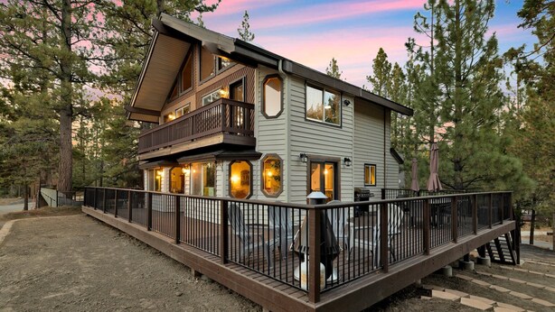 A two-story wooden house with a balcony, surrounded by trees. - Balboa at Big Bear #404 (Big Bear Lake)