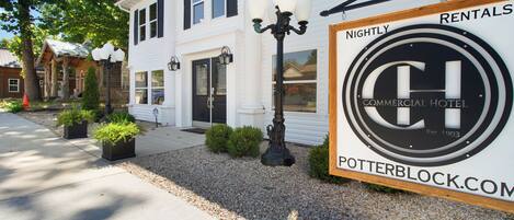 A commercial hotel with a sign indicating nightly rentals.
