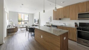 Fridge, dining tables - Landing | Modern 1BD, Courtyard, Gym (New York)