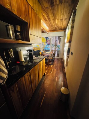 Fridge, microwave, stovetop, coffee/tea maker