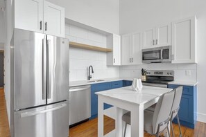 Fridge, dining tables - Landing | Chic 1BD, Gym, Yoga Studio (Greenville)