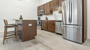 Fridge, dining tables - Landing | Stylish 1BD, Gym, Courtyard (St. Louis)