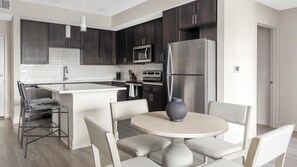 Fridge, dining tables - Landing | Stylish 2BD, Yoga Studio, Pool (Palmetto)