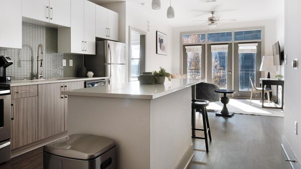 Fridge, dining tables - Landing | Spectacular 1BD, Rooftop Lounge (Atlanta)