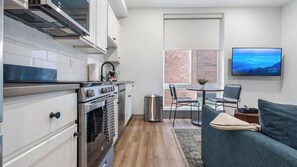 Fridge, dining tables - Landing | Chic 1BD, Gym (Philadelphia)
