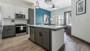Fridge, dining tables - Landing | Modern 1BD, Rooftop Lounge, Pool (Jacksonville)