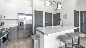 Fridge, dining tables - Landing | Stylish 1BD, Rooftop Lounge, Pool (Jacksonville)