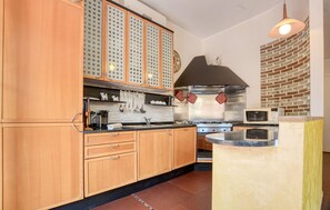 Fridge, stovetop, dishwasher, coffee/tea maker