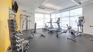 A gym with treadmills, elliptical machines, and free weights. - Landing | Amazing Studio, Clubhouse, Gym (Denver)