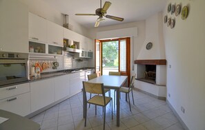 Fridge, stovetop, dishwasher, coffee/tea maker