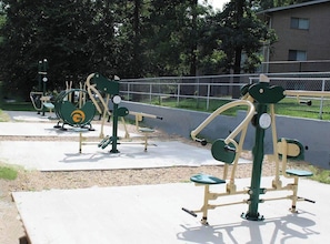 Outdoor exercise equipment in a park setting.