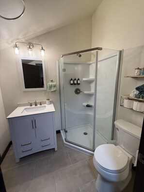 Shower, hair dryer, towels, soap