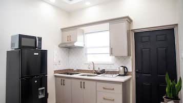 Fridge, microwave, stovetop, coffee/tea maker