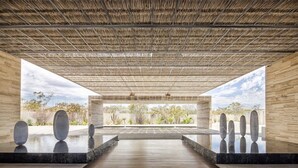 A modern spa with a wooden deck, a central water feature, and a view of the desert landscape. - Luxury Ocean View Villa-Los Cabos at Solaz Resort (San José del Cabo)