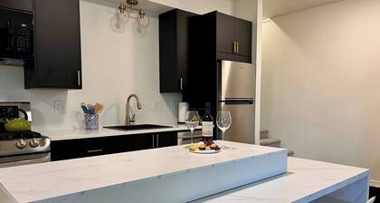 Nestled on the Marianna Butte Golf Course in Loveland, this modern garden-level basement retreat offers stunning mountain & lake views through large windows, flooding the space with light. Just a short drive to CSU campus & Estes Park