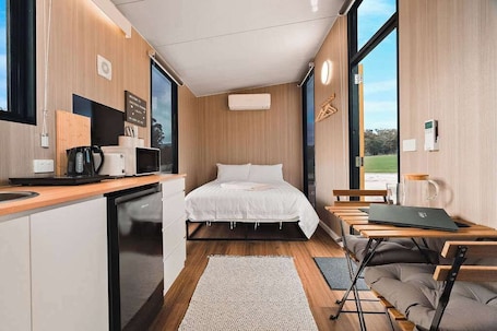 1 bedroom, bed sheets. Olive at Sheltered Paddock by Tiny Away