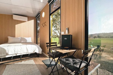 1 bedroom, bed sheets. Wren at Sheltered Paddock by Tiny Away