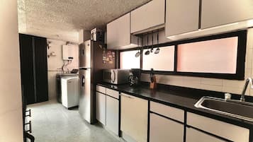 Fridge, microwave, stovetop, coffee/tea maker