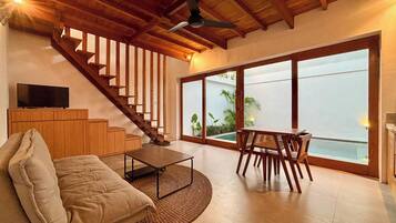 Villa with Pool View | Living area | 32-inch LCD TV with cable channels