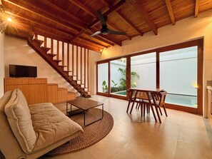 Villa with Pool View | Living area | 32-inch LCD TV with cable channels - Campbar 2 by AGATA (Cemagi)
