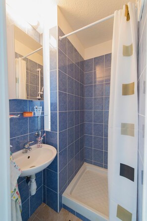 Shower, towels, soap, toilet paper