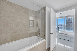 Hair dryer, towels, shampoo, toilet paper