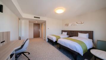 A hotel room with two beds, a desk, and a chair. There is a door leading to another room.