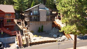 A multi-story building with a balcony, a staircase, and a driveway. - Heavenly Condo | Walk to Lift | Balcony | Sleeps 6 (Stateline)