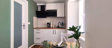 Fridge, microwave, stovetop, coffee/tea maker